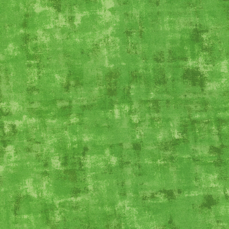 green fabric with a tonal, textured overlay