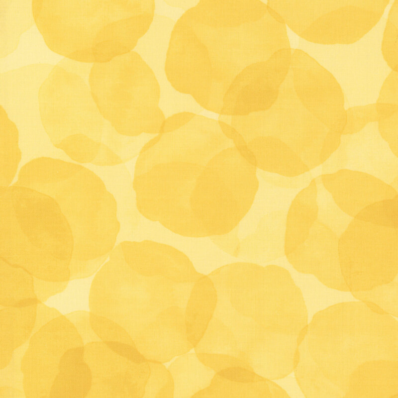 yellow fabric with large, tonal watercolor drops
