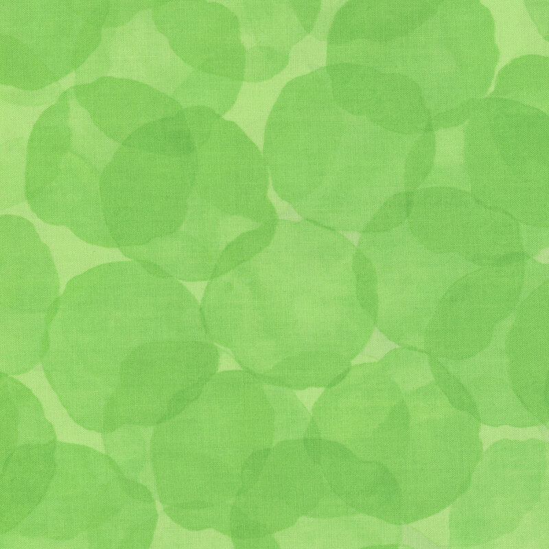 bright green fabric with large, tonal watercolor drops
