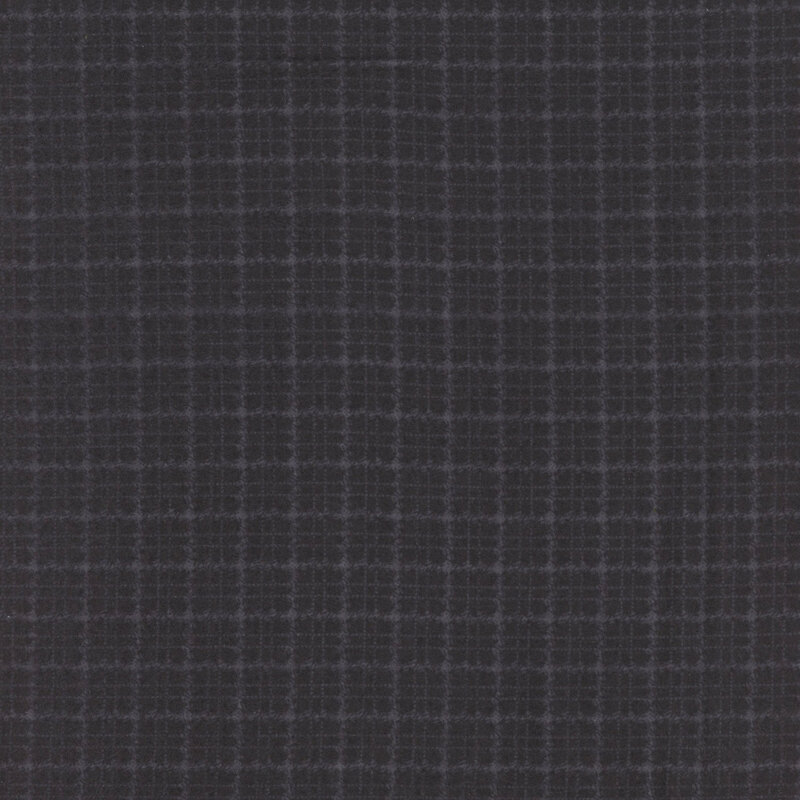 Black flannel fabric with a tonal plaid pattern