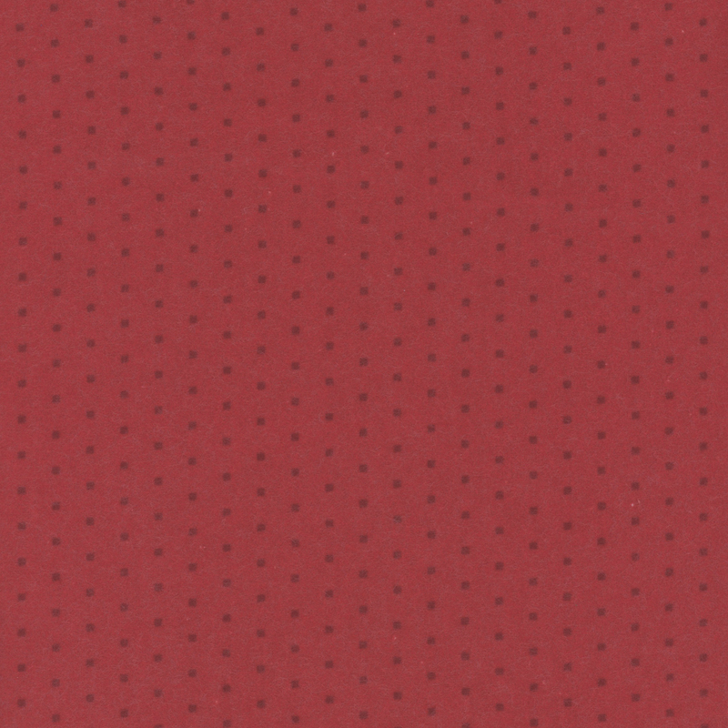 Red flannel fabric with a tonal polkadot pattern 