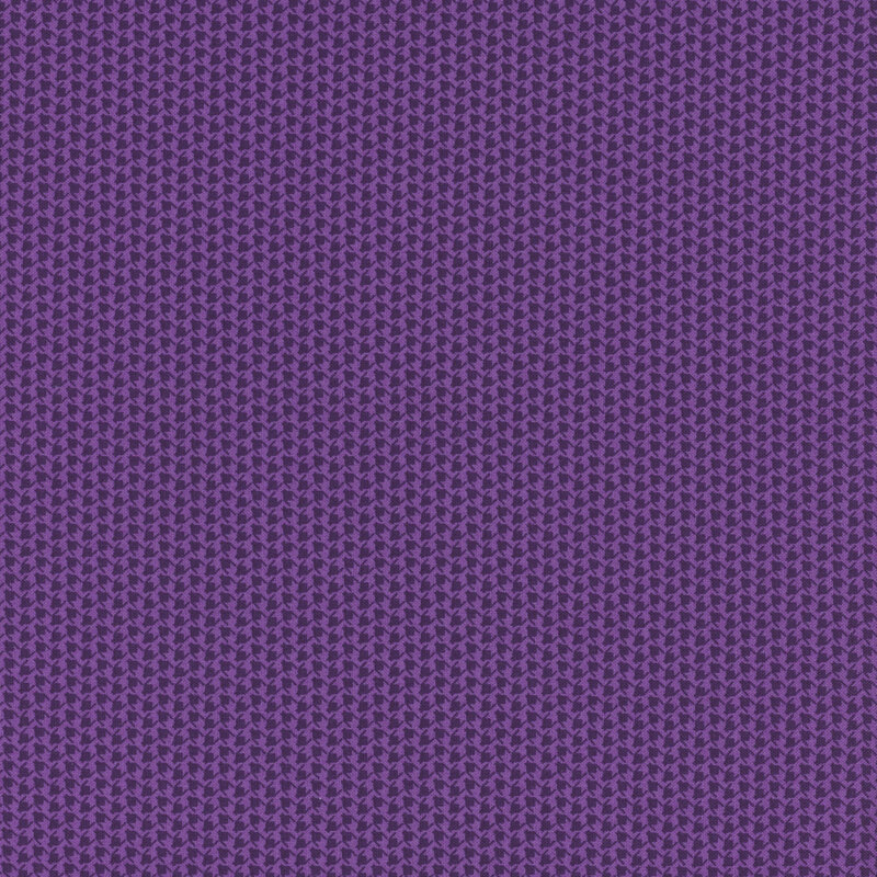 tonal dark purple fabric with alternating lines of houndstooth