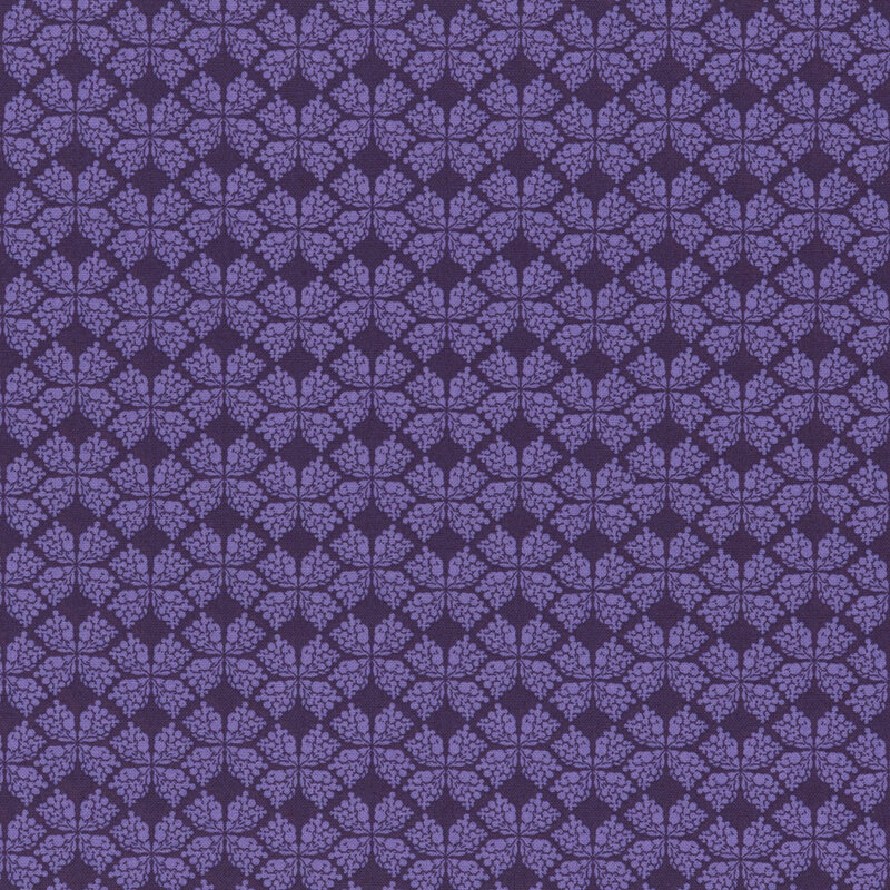 dark purple fabric with a geometric clover-like pattern