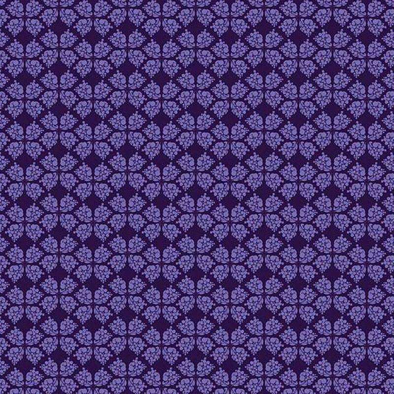 dark purple fabric with a geometric clover-like pattern