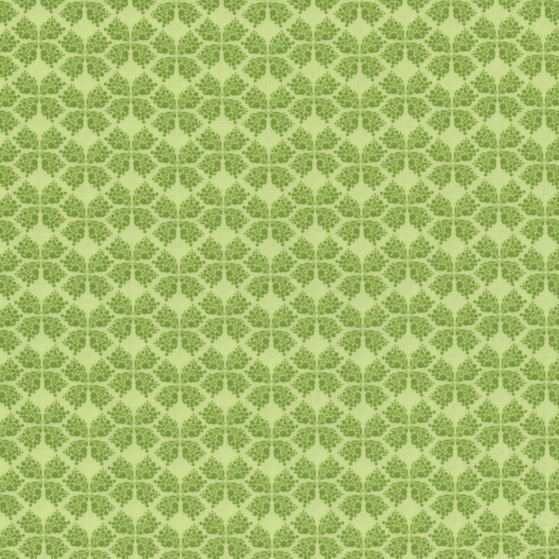 green fabric with a geometric clover-like pattern