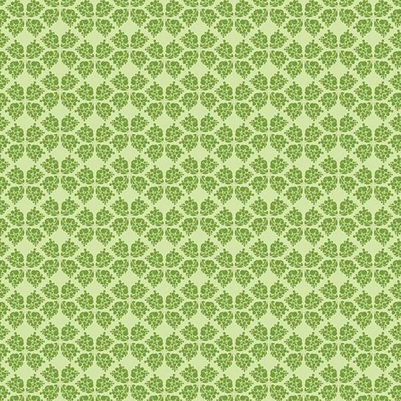 green fabric with a geometric clover-like pattern