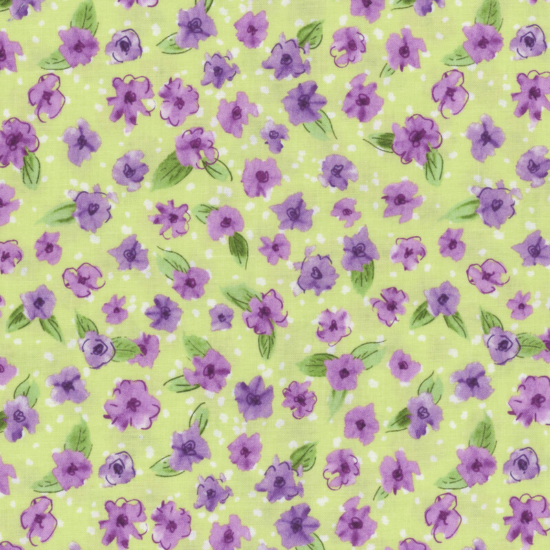 green fabric featuring purple flowers with leaves and small white splotches in the background