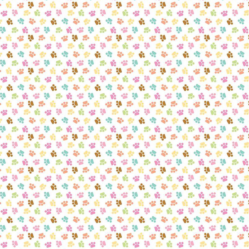 white sewing fabric with colorful ditsy cat paw prints throughout
