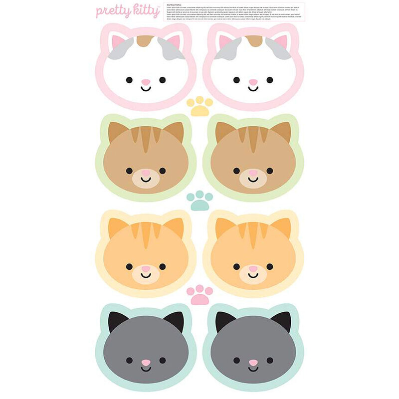 A fabric panel featuring 8 adorable kitty faces for making cat softies