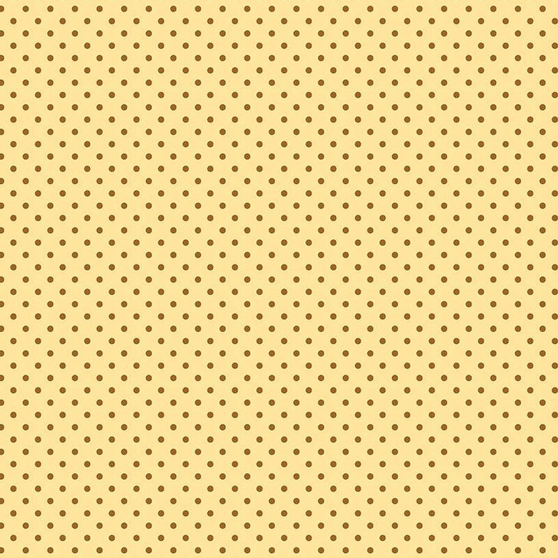 pastel yellow fabric with small brown polka dots all over