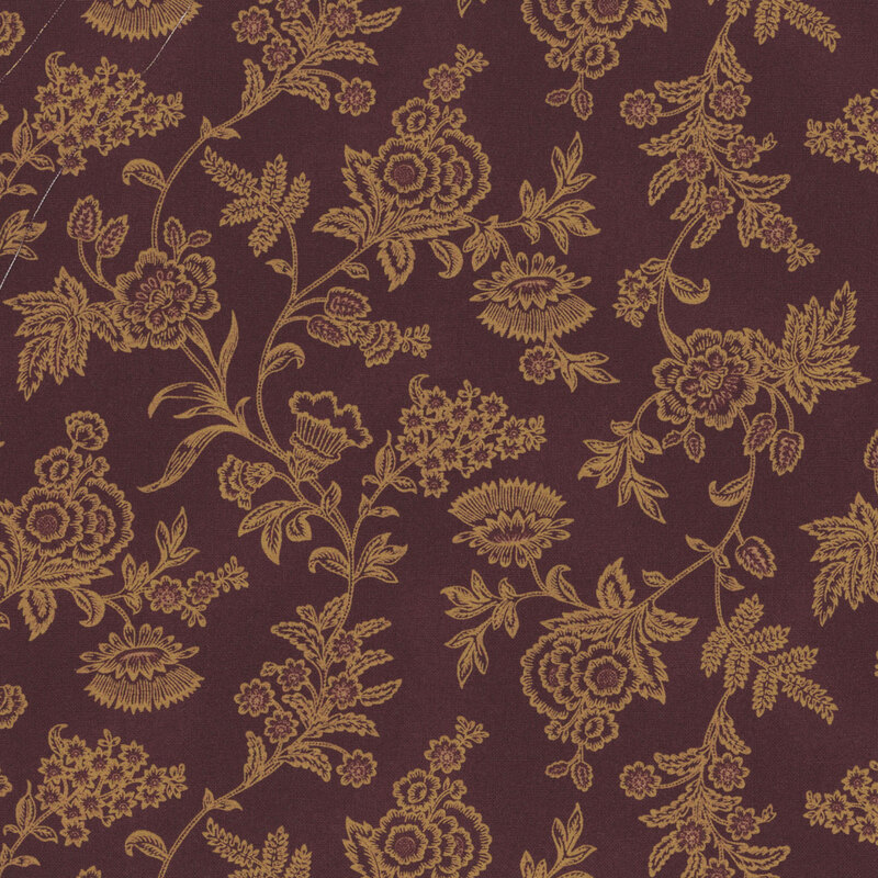 Mottled purple fabric with a golden floral pattern 