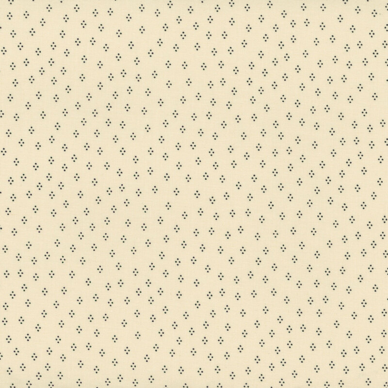 Cream fabric with a dancing dots pattern 