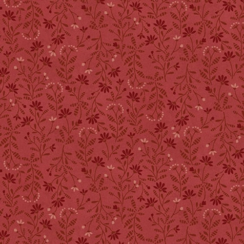 Red fabric with a tonal leaf and flower pattern 