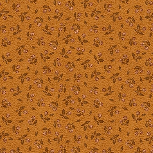 Orange fabric with a ditzy fruit pattern 