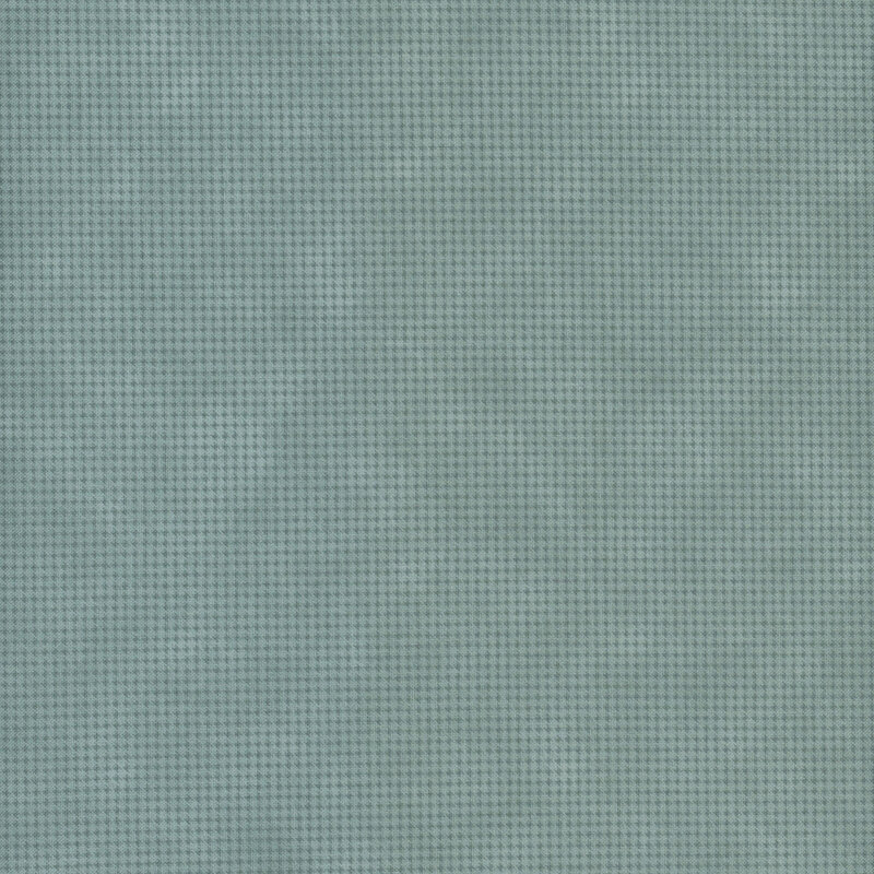 Mottled blue-green fabric with a small, repeating, dotted texture throughout