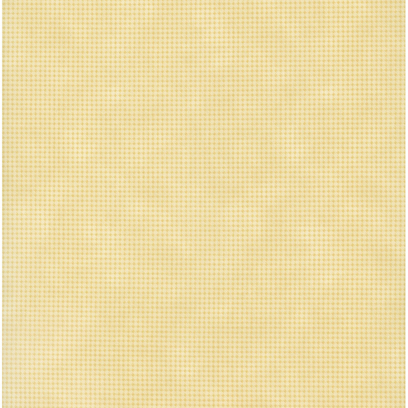 Mottled light yellow fabric with a small, repeating, dotted texture throughout