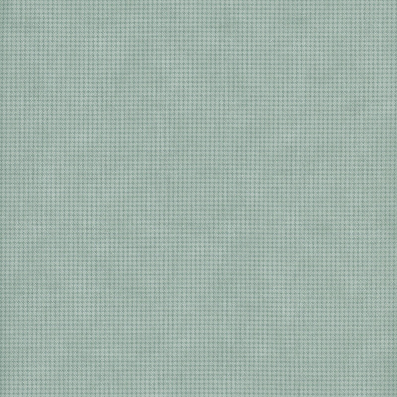 Mottled ocean-green fabric with a small, repeating, dotted texture throughout