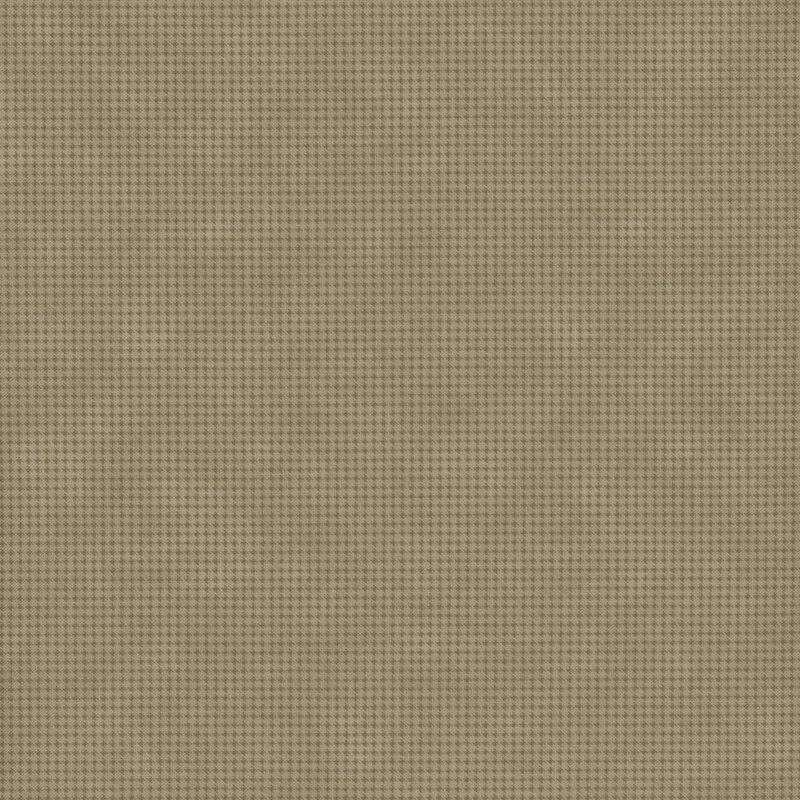 Mottled brown fabric with a small, repeating, dotted texture throughout