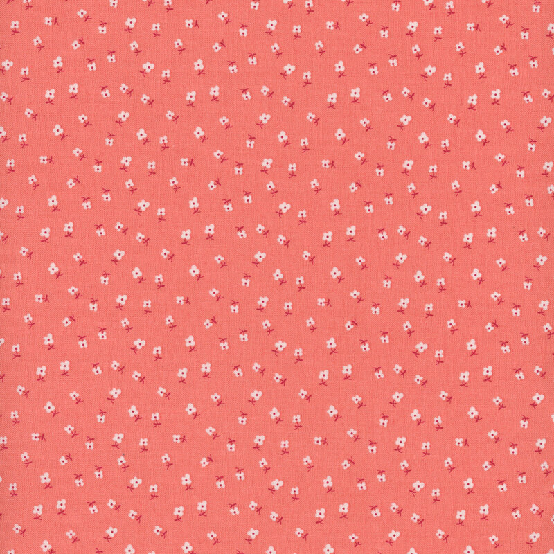 coral fabric with tiny scattered white flowers