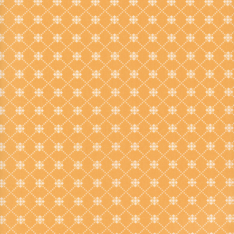 Peachy orange fabric with a white dotted trellis pattern.