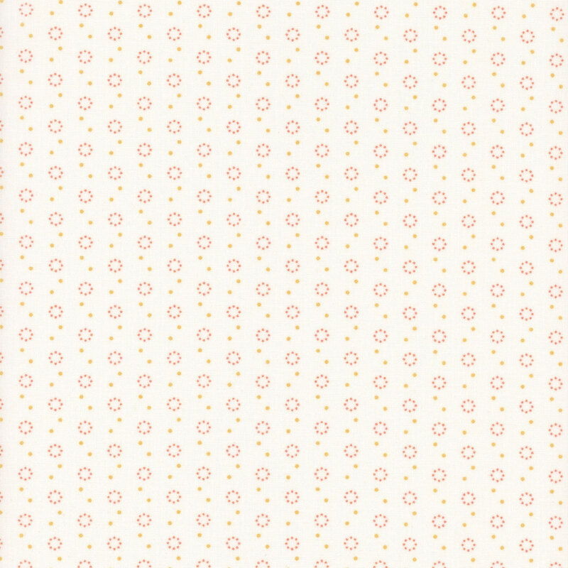 White fabric with polka dot and dot circle motifs in orange and peach.