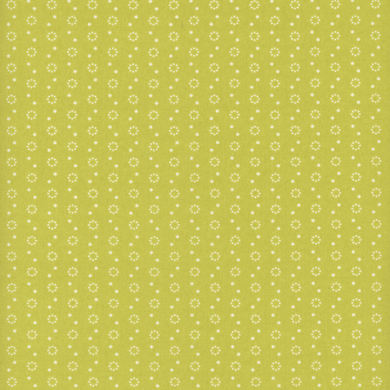 Lime green fabric with polka dot and dot circle motifs in white.