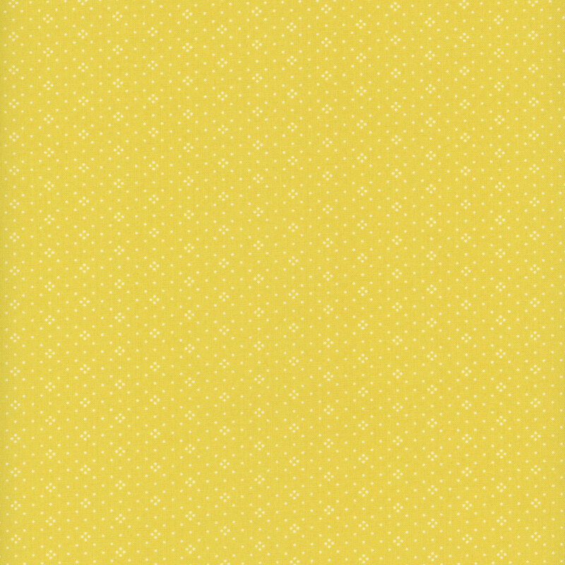 Bright lemon yellow fabric with a repeating geometric dotted pattern.