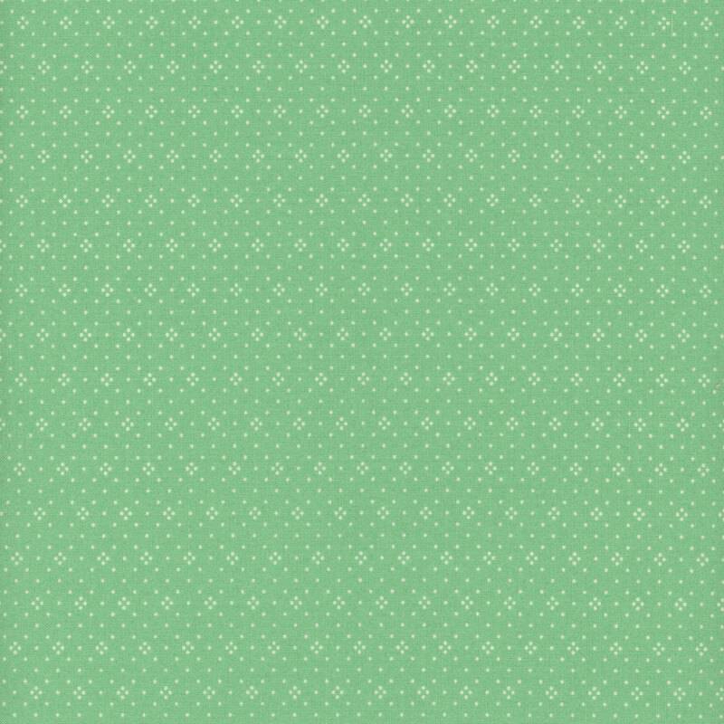Bright aqua green fabric with a repeating geometric dotted pattern.