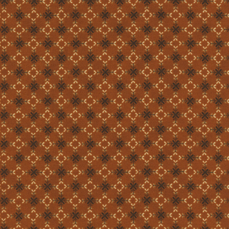 Fabric with light tan diamonds and dark sprigs against a burnt orange background