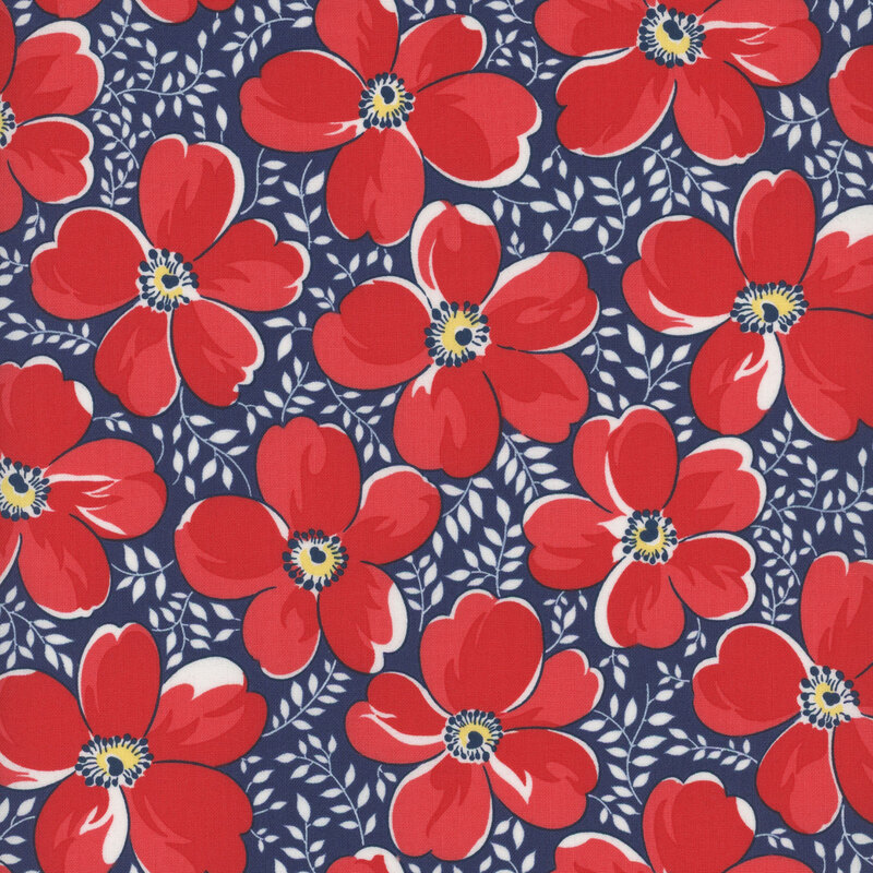 Navy blue fabric with small white leaves and vines and large red flowers throughout