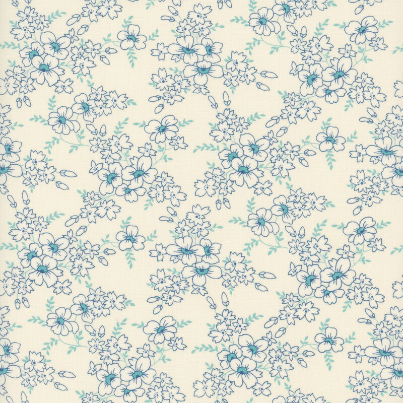 White fabric with clusters of white florals and blue centers with light blue leaves
