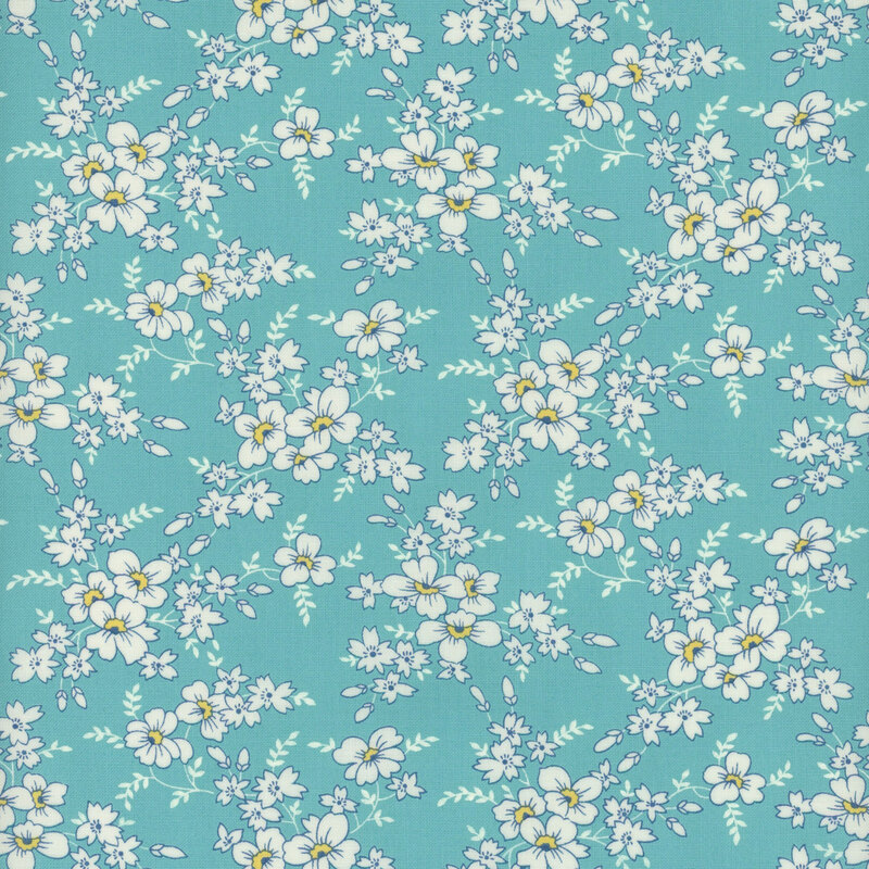Bright aqua blue fabric with clusters of white flowers and light aqua leaves 