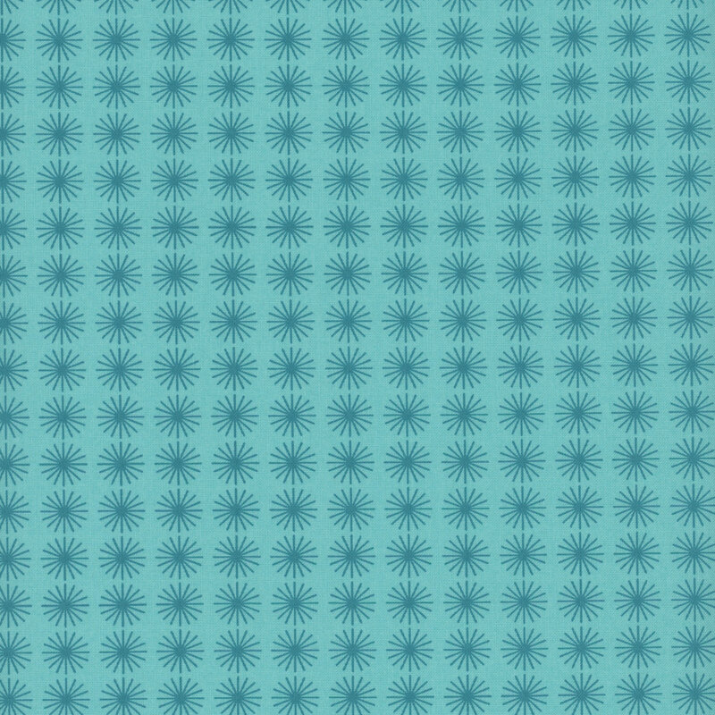 Bright aqua fabric with tonal circular teal starbursts spaced evenly throughout