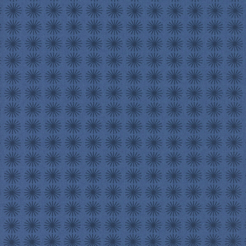 Tonal navy blue fabric with circular dark blue star bursts spaced evenly throughout