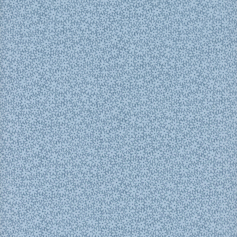 Light blue tonal fabric with packed floral outlines in dark blue all over