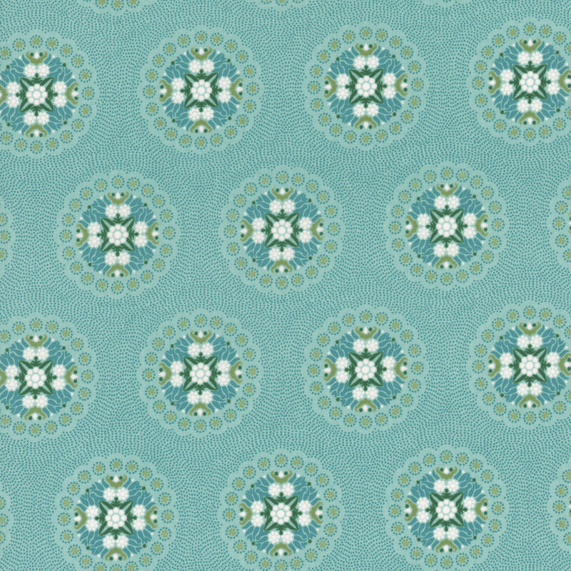 Aqua fabric with many small blue dots featuring a geometric design of florals