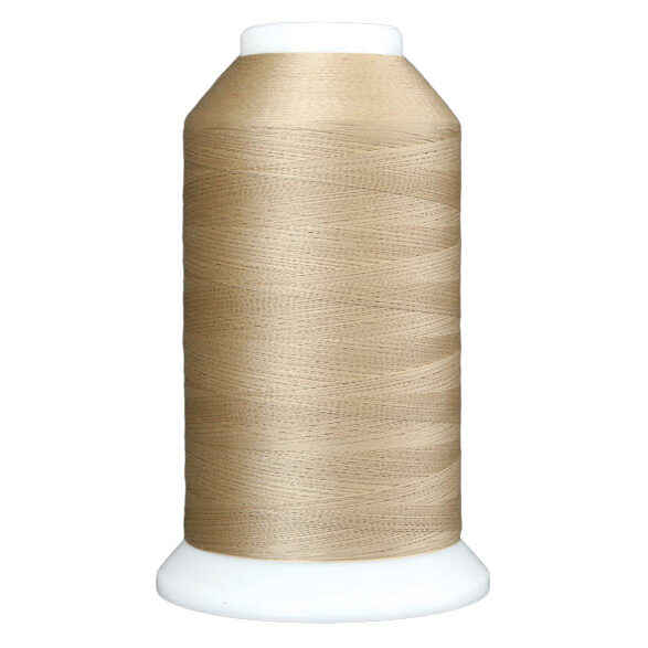Light tan spool of thread, isolated on a white background.
