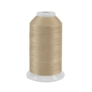 Light flaxen spool of thread, isolated on a white background.