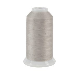 Cool silvery gray spool of thread, isolated on a white background.
