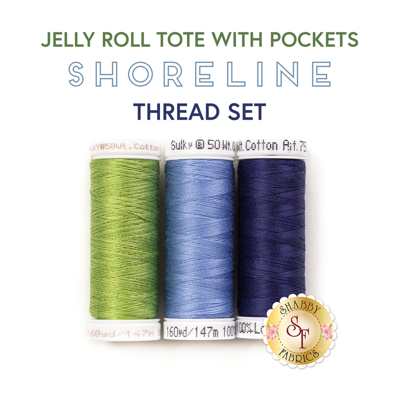 Three spools of thread in green, cornflower blue, and dark midnight blue on a white background below a text graphic that reads 