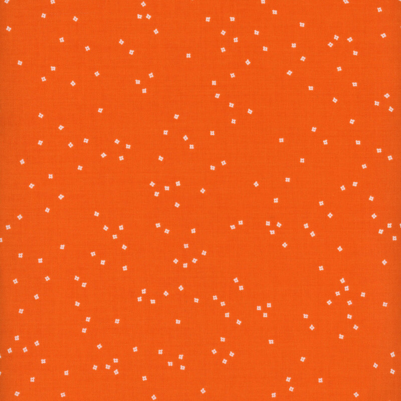 Small white flower blossoms scattered on a bright orange background