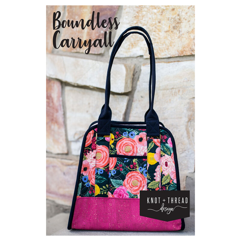 front of the Boundless Carryall pattern featuring the finished bag displayed in front of a stone wall