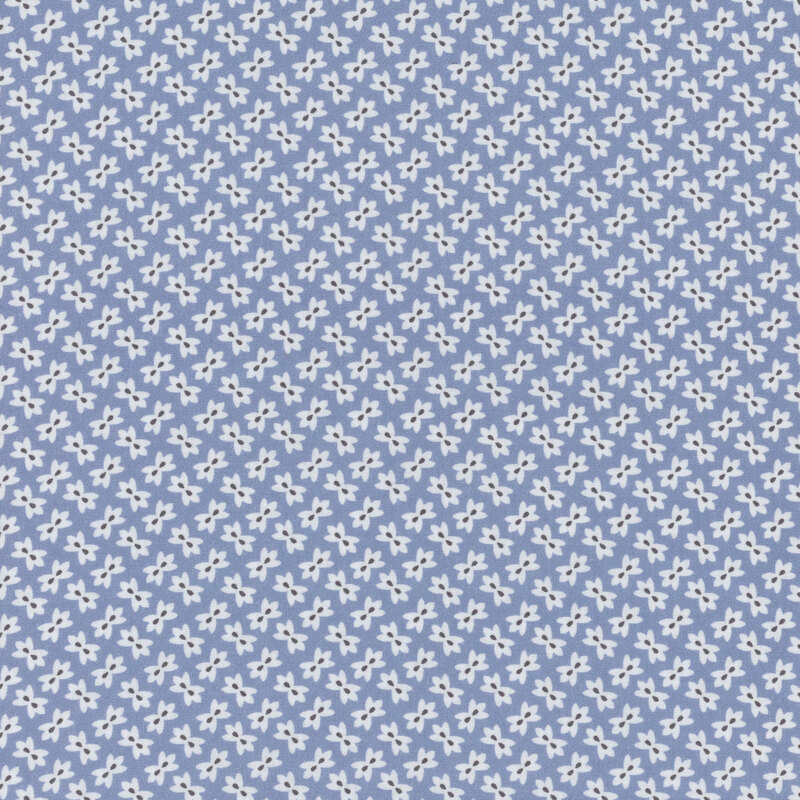 Denim blue fabric with small white alternating flowers throughout