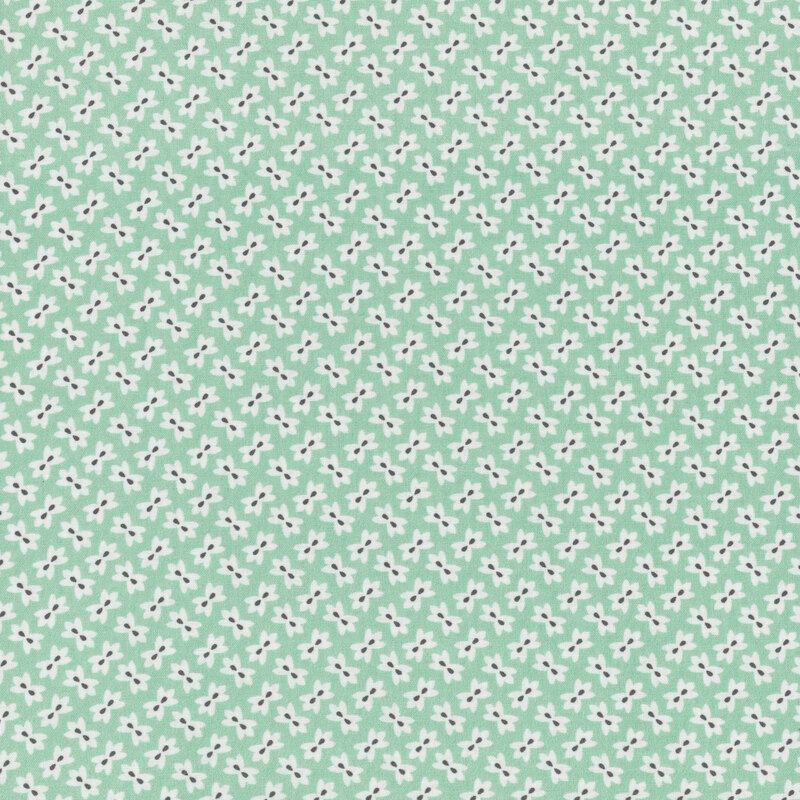 Aqua green fabric with small white alternating flowers throughout