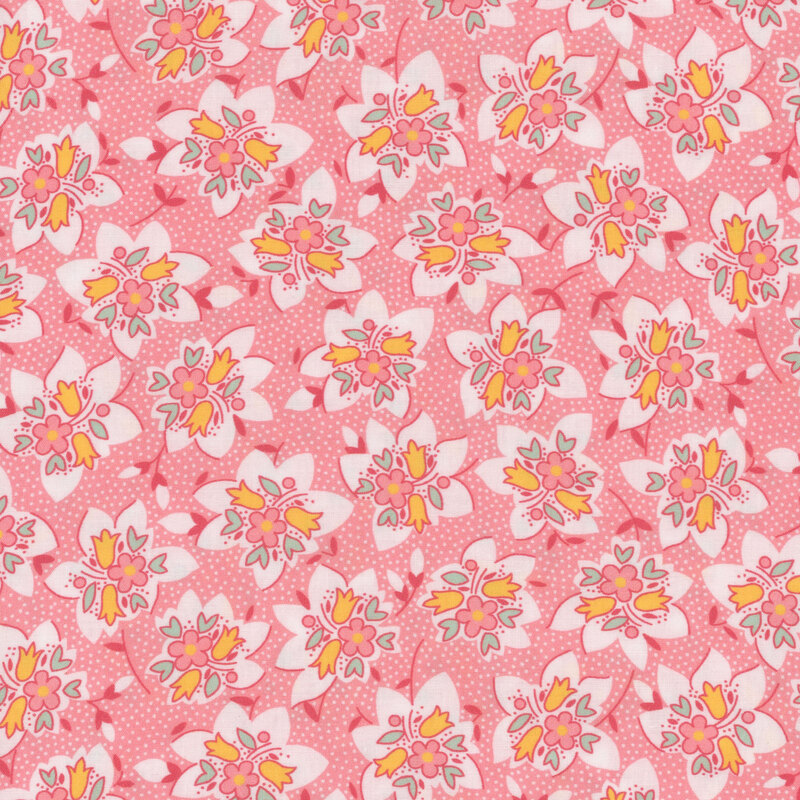 Pink fabric with clusters of colorful florals and tiny white dots throughout