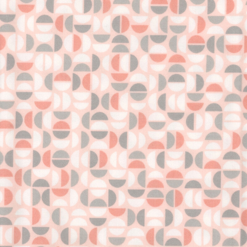 Light peach fabric featuring a geometric design of half circles in white, peach, and gray