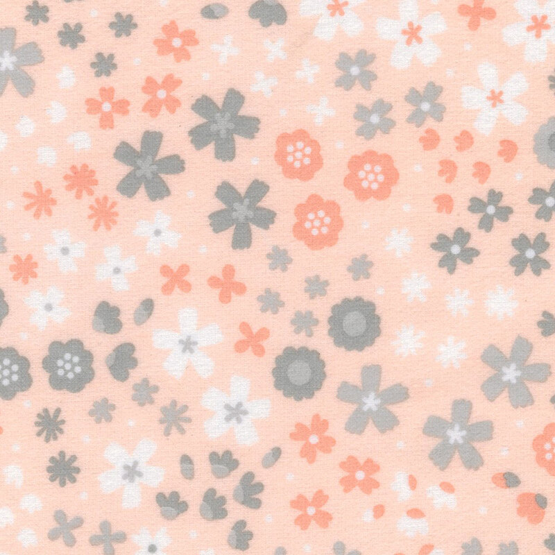 Pastel peach fabric featuring florals