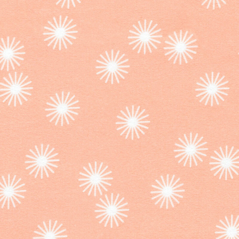 Peach fabric featuring white stars