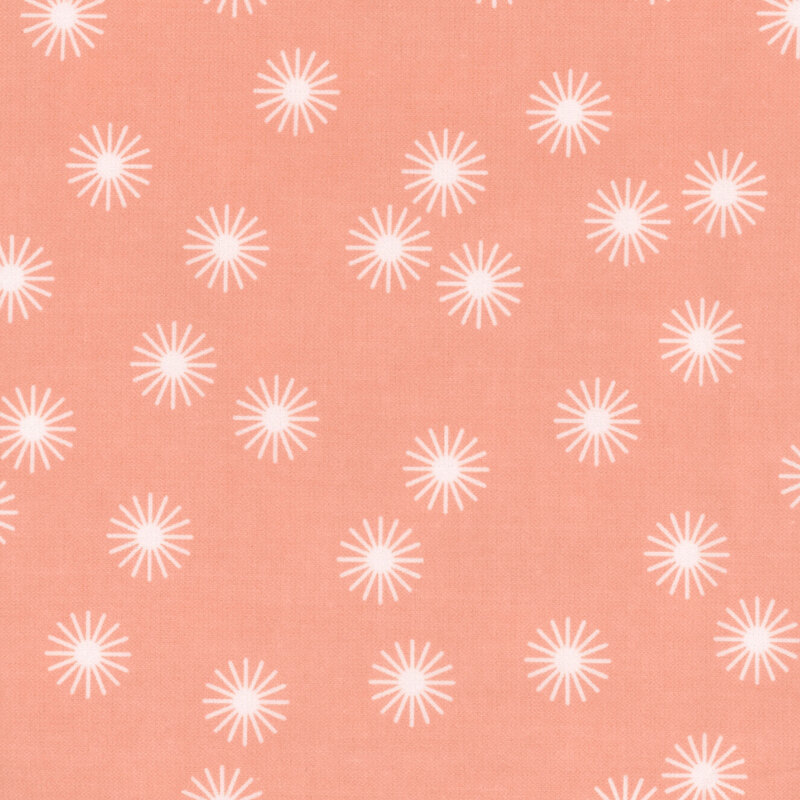 Peach fabric featuring white stars