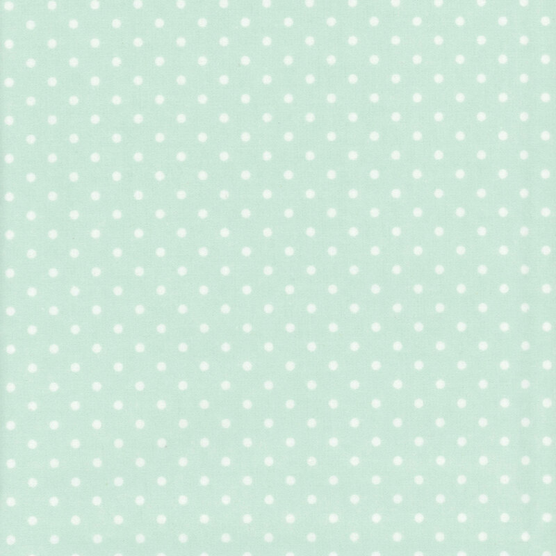 Pastel mint green fabric with white polka dots